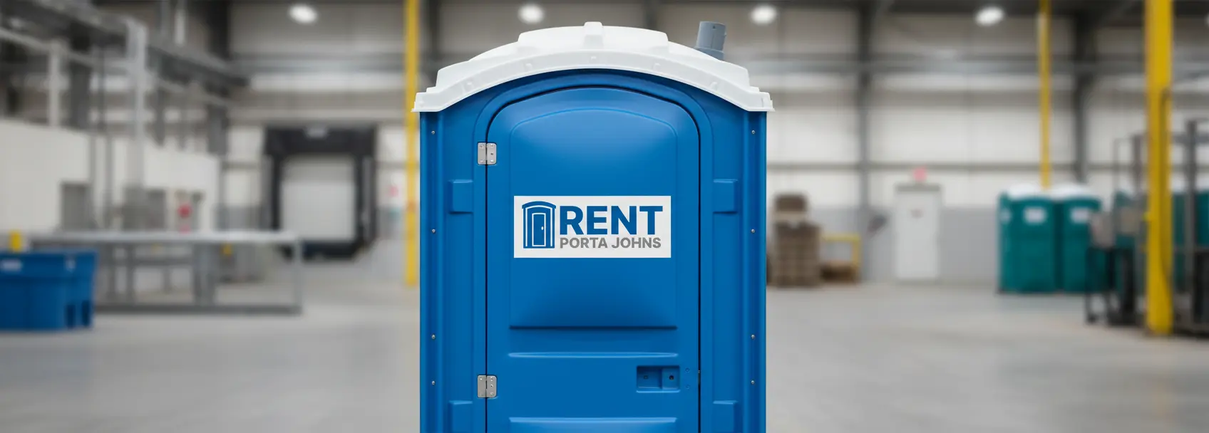 Blue portable restroom with Rent Porta Johns logo at an industrial manufacturing site